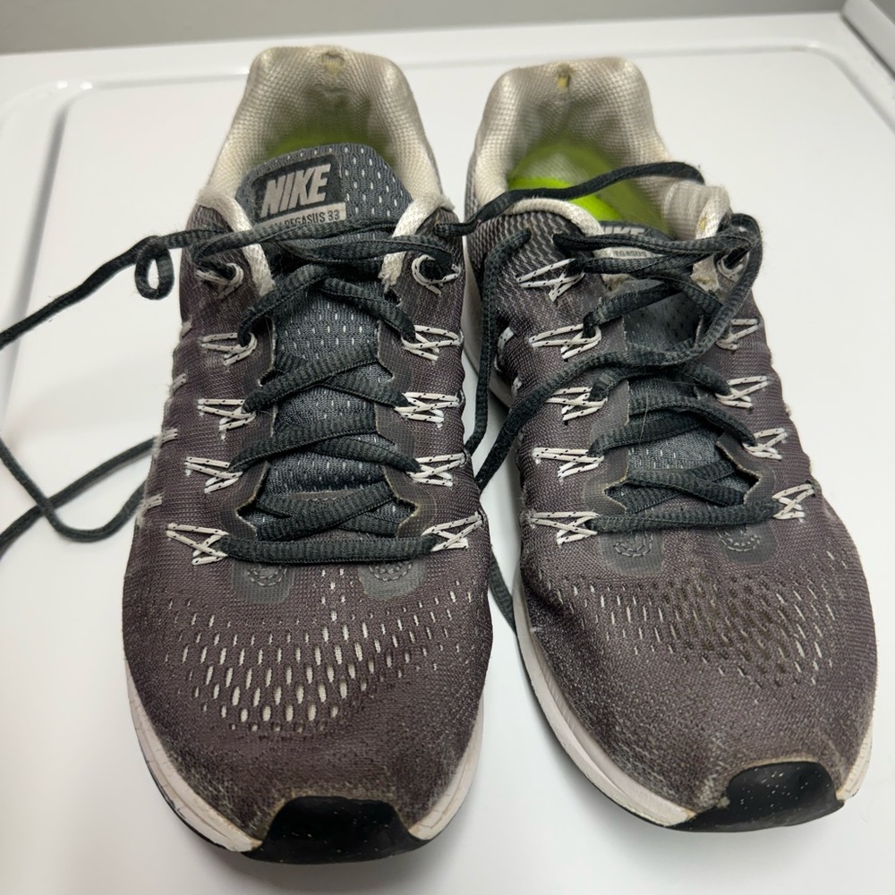 Grey Nike tennis shoes. Size 8